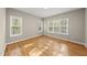Bedroom featuring wood floors and plenty of natural light from the large windows at 50 Beech Trl, Garner, NC 27529