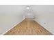 Large bonus room with vaulted ceiling, wood floors, and neutral walls at 50 Beech Trl, Garner, NC 27529
