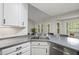 Modern kitchen featuring new appliances, gray quartz counters and a bright breakfast nook at 50 Beech Trl, Garner, NC 27529