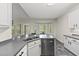 Modern kitchen featuring new appliances, gray quartz counters and a bright breakfast nook at 50 Beech Trl, Garner, NC 27529