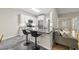 The kitchen features a peninsula counter, stainless appliances and opens to the living room at 50 Beech Trl, Garner, NC 27529