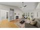Bright living room with fireplace, hardwood floors, and neutral decor for a relaxing atmosphere at 50 Beech Trl, Garner, NC 27529