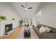 Bright living room with fireplace, hardwood floors, and neutral decor for a relaxing atmosphere at 50 Beech Trl, Garner, NC 27529