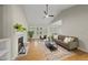 Bright living room with fireplace, hardwood floors, and neutral decor for a relaxing atmosphere at 50 Beech Trl, Garner, NC 27529