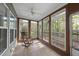 Inviting sunroom features lots of natural light and a relaxing rocking chair to enjoy the views at 50 Beech Trl, Garner, NC 27529