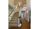 Spacious foyer featuring a staircase with wood railings, carpeted steps, and lots of light at 510 Braden Dr, Durham, NC 27713