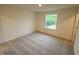 This is a bedroom with a carpeted floor and a window with green outdoor views at 512 Eastwood St, Durham, NC 27704
