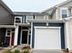 Charming two-story townhome with a one-car garage and craftsman design elements at 512 Eastwood St, Durham, NC 27704