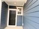 Inviting entryway with a modern front door and stylish exterior trim at 512 Eastwood St, Durham, NC 27704