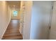Hallway with wood-look flooring leading to the living area at 512 Eastwood St, Durham, NC 27704