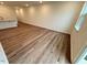 Spacious living room with wood-look floors and views of the outdoors at 512 Eastwood St, Durham, NC 27704