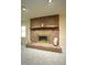 A cozy fireplace features a brick hearth, perfect for a relaxing evening at home at 5200 Lorbacher Rd, Apex, NC 27539