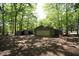 Detached garage and shed with ample storage space, ideal for vehicles and outdoor equipment at 5200 Lorbacher Rd, Apex, NC 27539