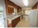 Traditional kitchen with ample counter space and white appliances, perfect for home cooking at 5200 Lorbacher Rd, Apex, NC 27539