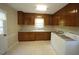 Functional laundry room with washer, dryer, and ample cabinet storage space at 5200 Lorbacher Rd, Apex, NC 27539