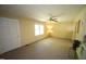 Spacious living room featuring a ceiling fan, large window, and ample natural light at 5202 Lorbacher Rd, Apex, NC 27539