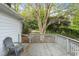 Wooden deck with mature landscaping and a winding garden path at 611 Beaver Dam Rd, Raleigh, NC 27607