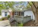 A wooden deck in the backyard has stairs leading to a patio and a fenced yard at 611 Beaver Dam Rd, Raleigh, NC 27607