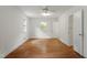 Cozy bedroom with hardwood floors and a window offering scenic outdoor views and natural light at 611 Beaver Dam Rd, Raleigh, NC 27607