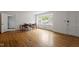Dining room showcasing classic hardwood floors, bright windows, and ample space at 611 Beaver Dam Rd, Raleigh, NC 27607