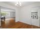 Spacious dining room with an open layout, hardwood floors, and a view into the laundry area at 611 Beaver Dam Rd, Raleigh, NC 27607
