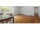 Traditional dining room with hardwood flooring and generous natural light from the adjacent windows at 611 Beaver Dam Rd, Raleigh, NC 27607