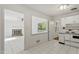 Open concept view from kitchen to the living room with fireplace, creating a cohesive living space at 611 Beaver Dam Rd, Raleigh, NC 27607