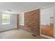 Cozy room with brick accent wall and natural light at 611 Beaver Dam Rd, Raleigh, NC 27607