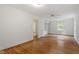 Spacious main bedroom with hardwood floors, ceiling fan, and a window providing natural light at 611 Beaver Dam Rd, Raleigh, NC 27607