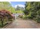 Brick patio with lush landscaping viewed from above provides a private outdoor space at 611 Beaver Dam Rd, Raleigh, NC 27607