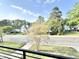View from balcony featuring mature trees, blue sky and residential neighborhood at 622 Glascock St, Raleigh, NC 27604