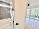 Bathroom features tiled shower with glass door and bedroom with hardwood floors and outdoor access at 622 Glascock St, Raleigh, NC 27604