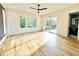 Bright bedroom with hardwood floors, generous windows, and sliding glass door to outdoor deck at 622 Glascock St, Raleigh, NC 27604