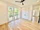 Bedroom featuring hardwood floors, large sliding glass doors and large closet doors at 622 Glascock St, Raleigh, NC 27604