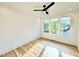 Bright bedroom featuring hardwood floors, white walls and trim, recessed lighting and large window at 622 Glascock St, Raleigh, NC 27604