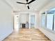 Bonus room featuring hardwood floors, wet bar with beverage center and multiple entry ways at 622 Glascock St, Raleigh, NC 27604