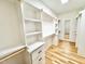 Bright walk-in closet with custom shelving and wooden floors offers ample storage at 622 Glascock St, Raleigh, NC 27604