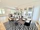 Dining room features modern lighting, stylish decor, and seamless access to the outdoor patio at 622 Glascock St, Raleigh, NC 27604