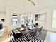 Modern dining room with stylish lighting, hardwood floors, and a table set for a meal at 622 Glascock St, Raleigh, NC 27604