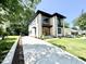 Modern two-story home showcasing a well-kept yard, a long driveway and a stylish facade at 622 Glascock St, Raleigh, NC 27604