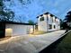 Twilight exterior shot of a new build, modern home and detached garage on a large property at 622 Glascock St, Raleigh, NC 27604