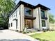 Eye-catching two-story home featuring a modern facade, long driveway and well-maintained lawn at 622 Glascock St, Raleigh, NC 27604