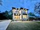 Twilight front exterior view of modern home with mixed materials and illuminated address numbers at 622 Glascock St, Raleigh, NC 27604
