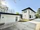 Detached two-car garage with white door and modern design, next to the home at 622 Glascock St, Raleigh, NC 27604