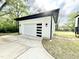 Close up view of the white two-car garage featuring a modern design and plenty of space at 622 Glascock St, Raleigh, NC 27604