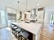 Bright kitchen features a large island, stainless appliances, and open shelving at 622 Glascock St, Raleigh, NC 27604