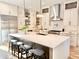 Well-lit modern kitchen with stainless steel appliances and large island with seating at 622 Glascock St, Raleigh, NC 27604