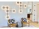 Stylish living room featuring modern light fixture and comfortable seating area with accent pillows and neutral colors at 622 Glascock St, Raleigh, NC 27604