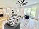Modern living room with fireplace, plush seating, and open layout, perfect for relaxation and entertaining at 622 Glascock St, Raleigh, NC 27604
