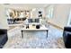 Bright living room features large windows, modern decor, and seamless flow into the dining area at 622 Glascock St, Raleigh, NC 27604
